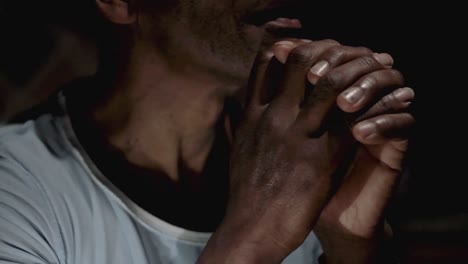 man praying to god with hands together on black background stock video stock footage