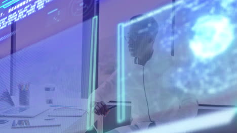 animación de gráficos, globo sobre hombre afroamericano pensativo trabajando en la computadora portátil en la oficina