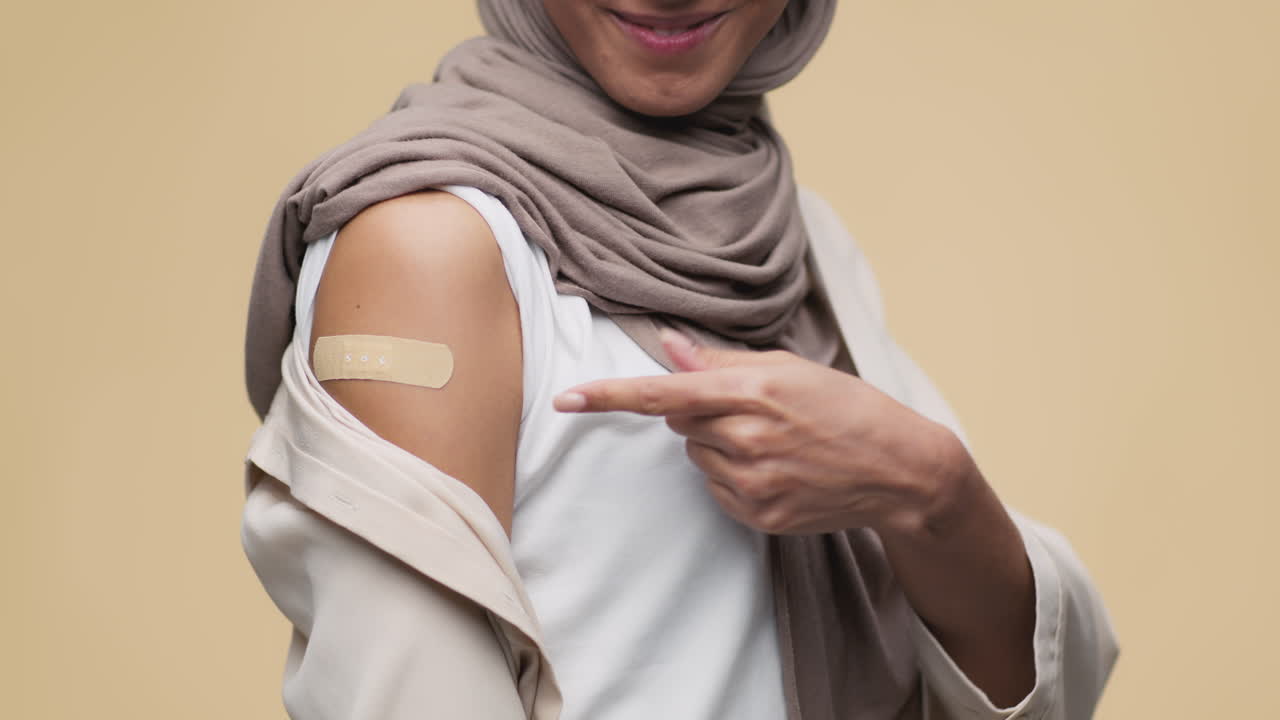 Woman Showing Vaccination Bandage