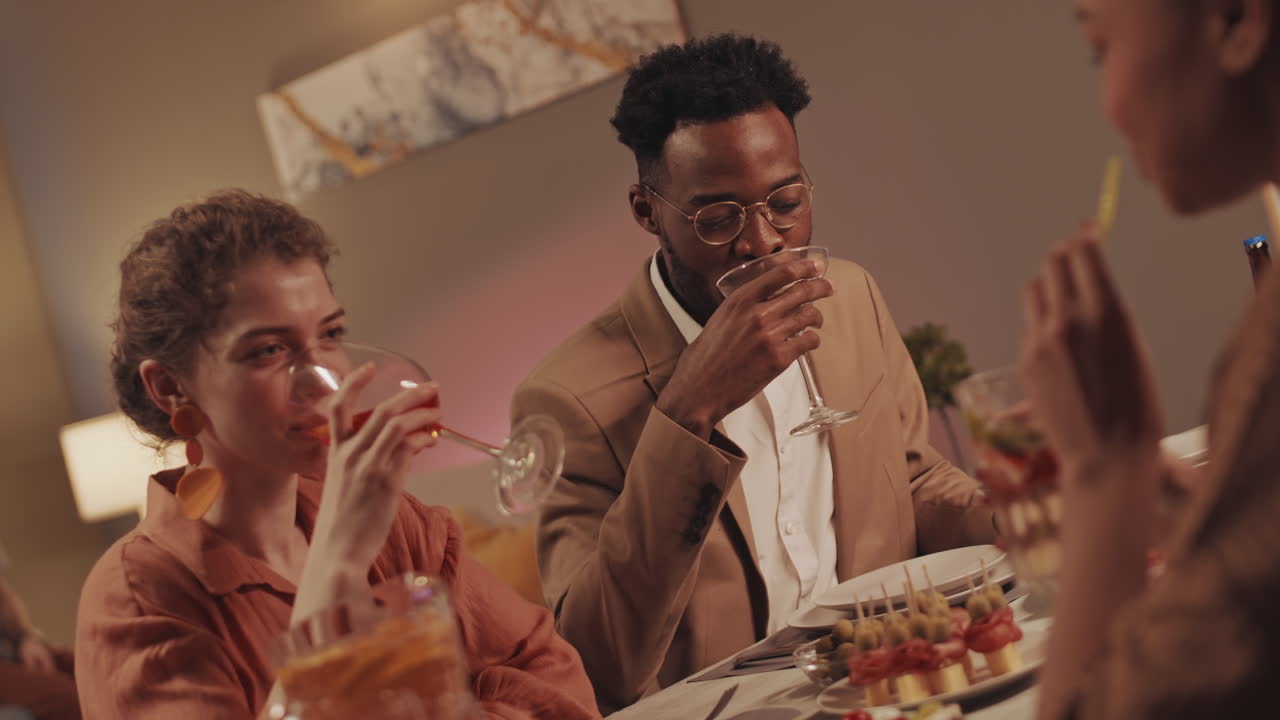 Friends Celebrating at Dinner Table