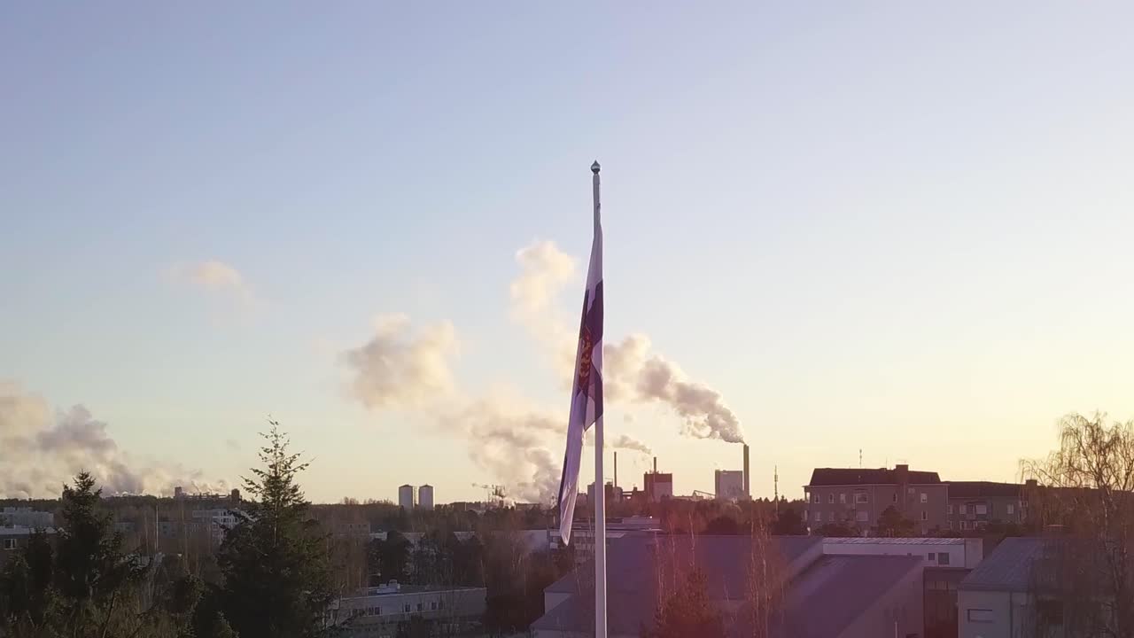 Paper industry is big part of finnish economy system. Vertigo pullback with drone, at the part of end there are Finnish Flag top of the flagpole on the center of picture.