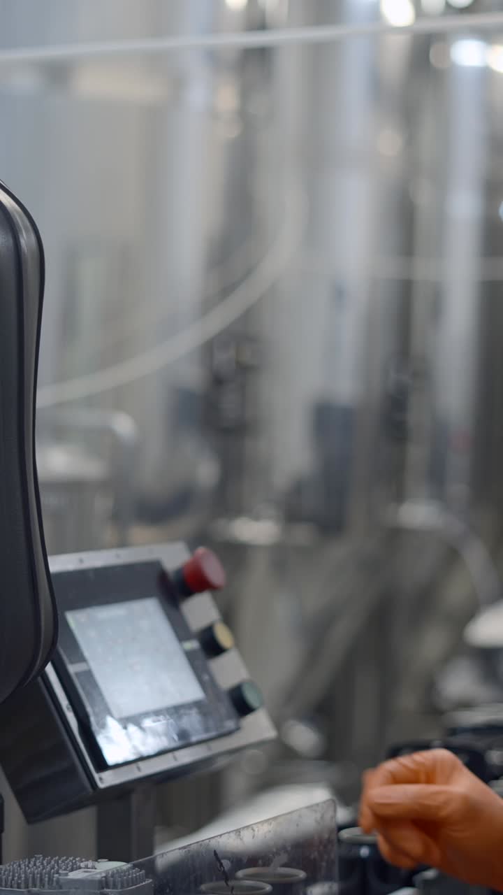 Worker Operating Industrial Machinery in a Cleanroom Environment