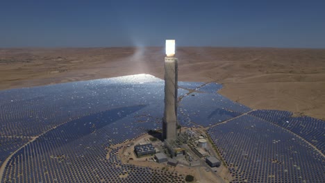 tallest solar power tower in the world exists in a desolate desert - drone pull back