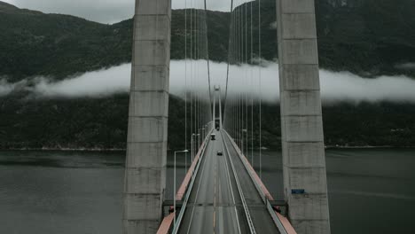 cinematic time lapse of hardanger suspensjon bridge and moving cloud over it