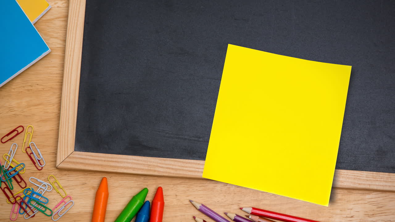 Animation of memo note with copy space over chalkboard on desk