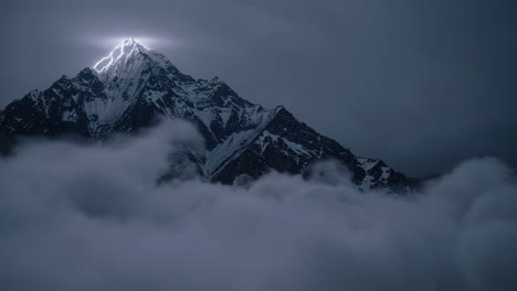 lightning strikes mountain peak above clouds