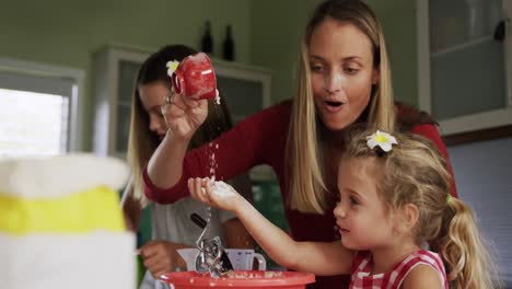 Mother-and-daughters-cooking-crepes-together