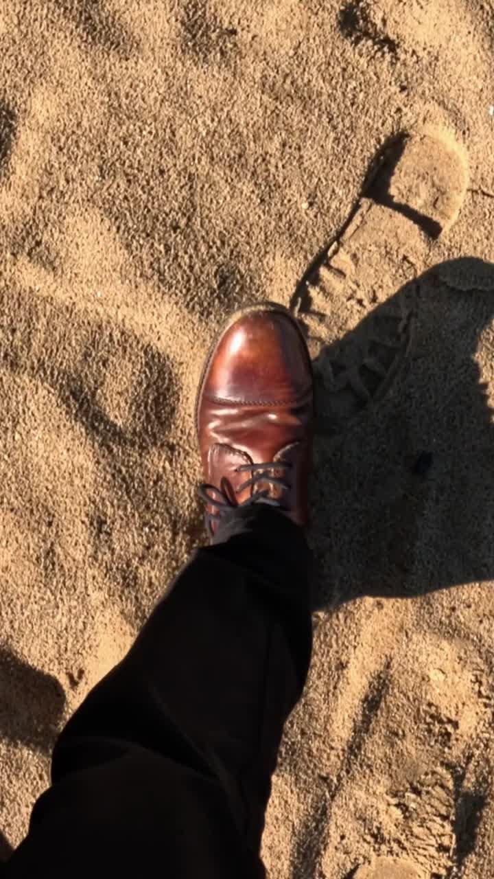 Elegant Man Walking on Sand: Close Up of Leather Shoes on Beach