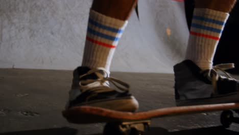 man practicing skateboarding in skateboard arena 4k