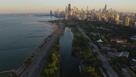 drone flying above lincoln park, chicago on beautiful summer day in the city