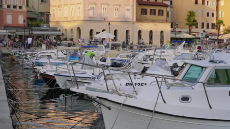 boats at a marina in a croatian town at sunset