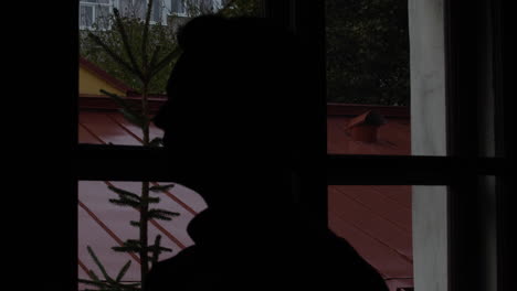 silhouette of a priest at the church