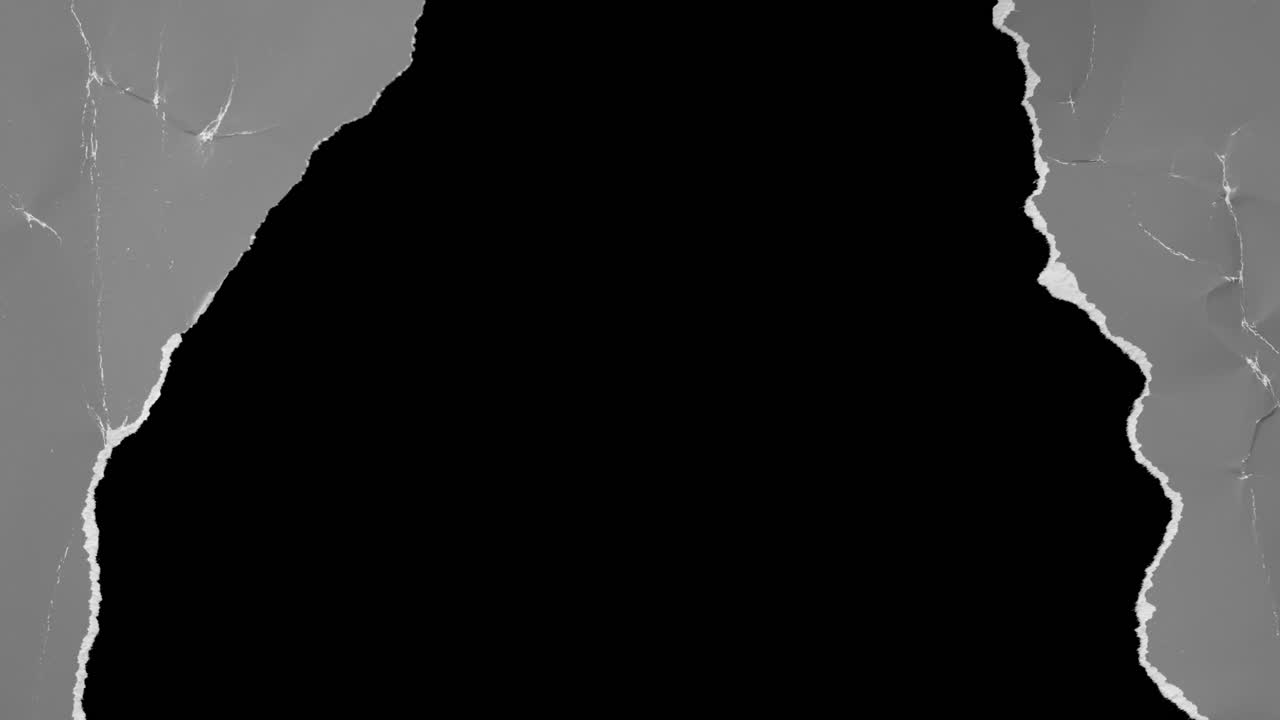 Gray Paper Tearing to Reveal Black Background