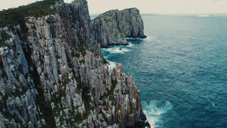 cape hauy drone circling rock view in tasmania, australia