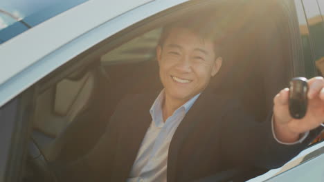 happy man receiving his new electric car