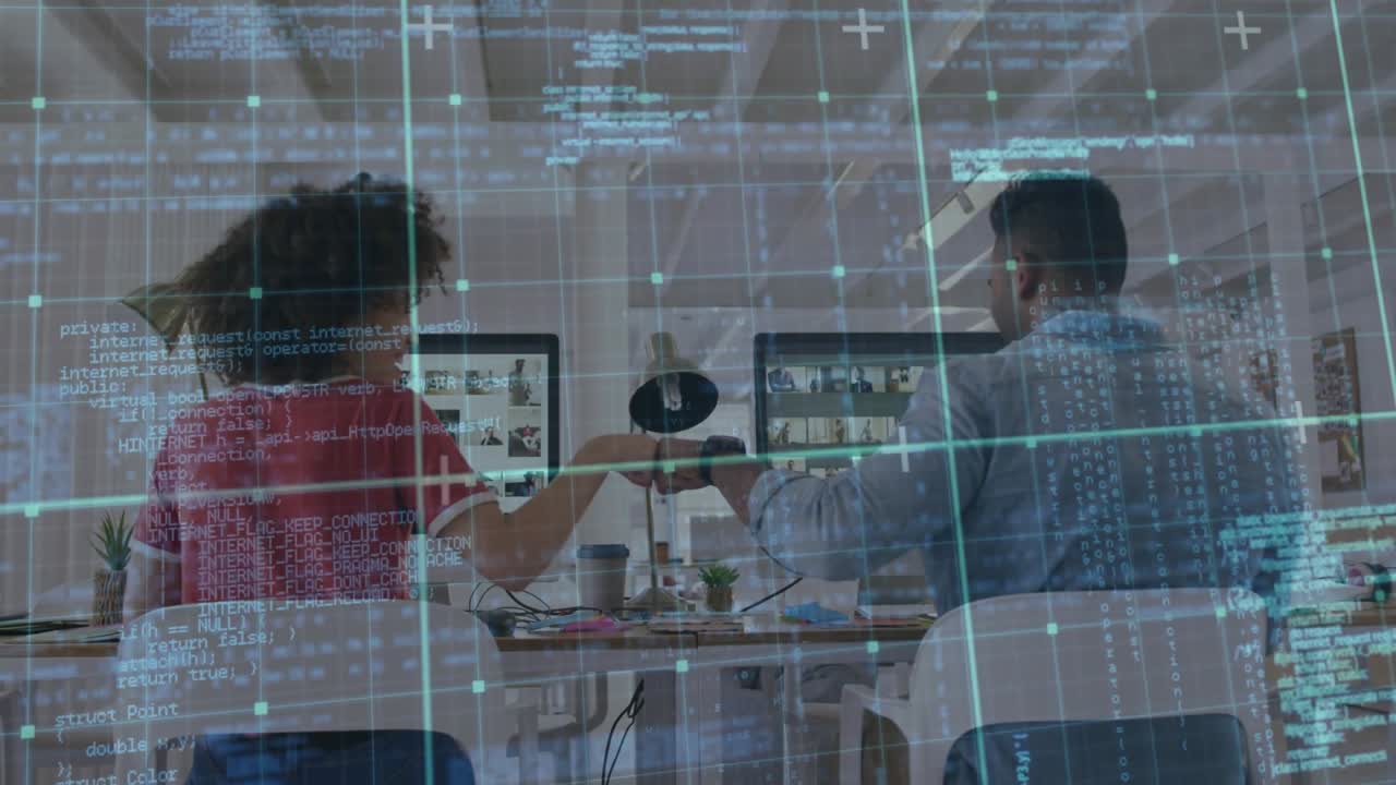 Software developers typing code at shared desk and celebrating milestone with animated code overlay