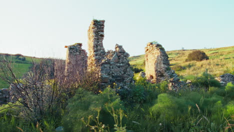 ancient ruin in a meadow in the nature remains of walls of a historic house