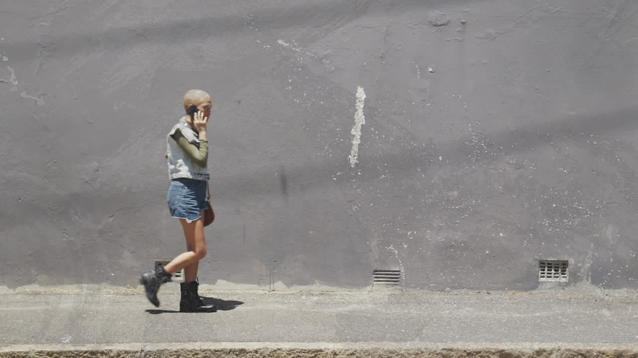 Animation of caucasian woman with smartphone over grey changing background