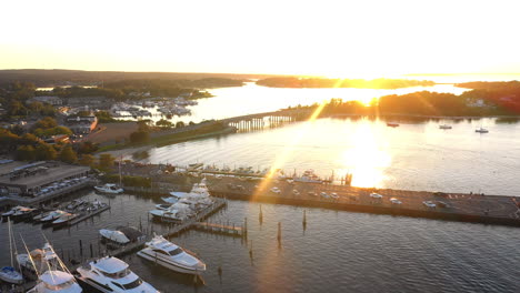 aerial flyover of beautiful sag harbor in the hamptons at sunset