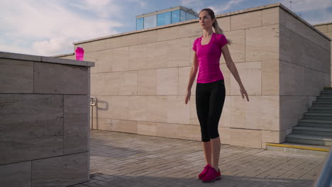 woman performing outdoor fitness exercises