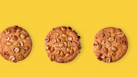 seamless looping animation of peanut cookies. one row of different homemade pastries on a yellow background