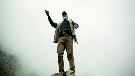 man standing on a rock enjoying the view