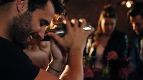 bartender preparing cocktail at bar counter