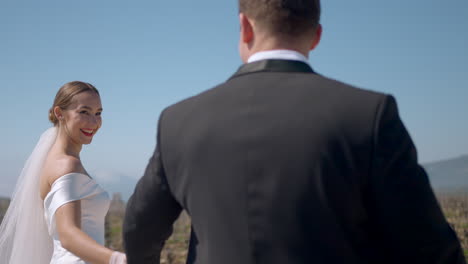 bride and groom in vineyard