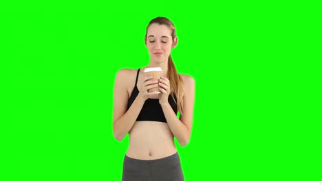 Fit-model-drinking-from-disposable-cup