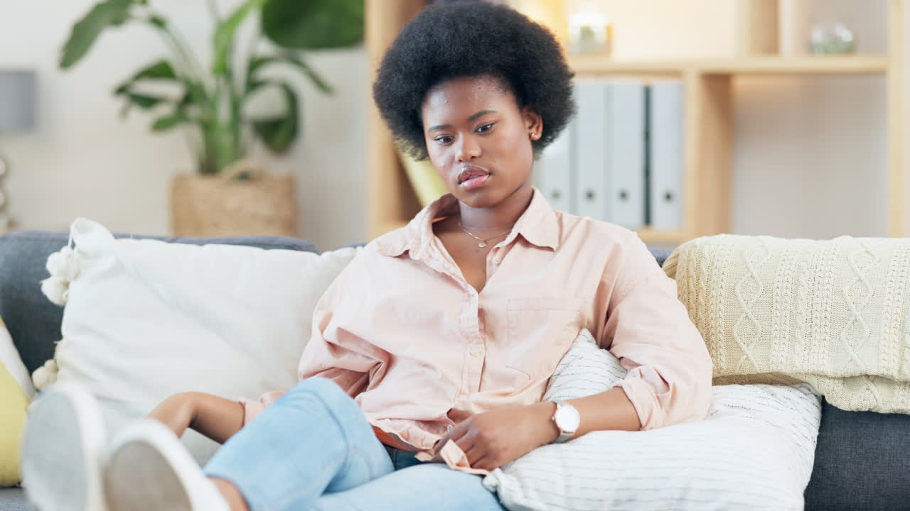 Trendy woman watching a boring movie