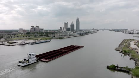 barge in mobile bay in mobile, alabama with drone video moving right to left