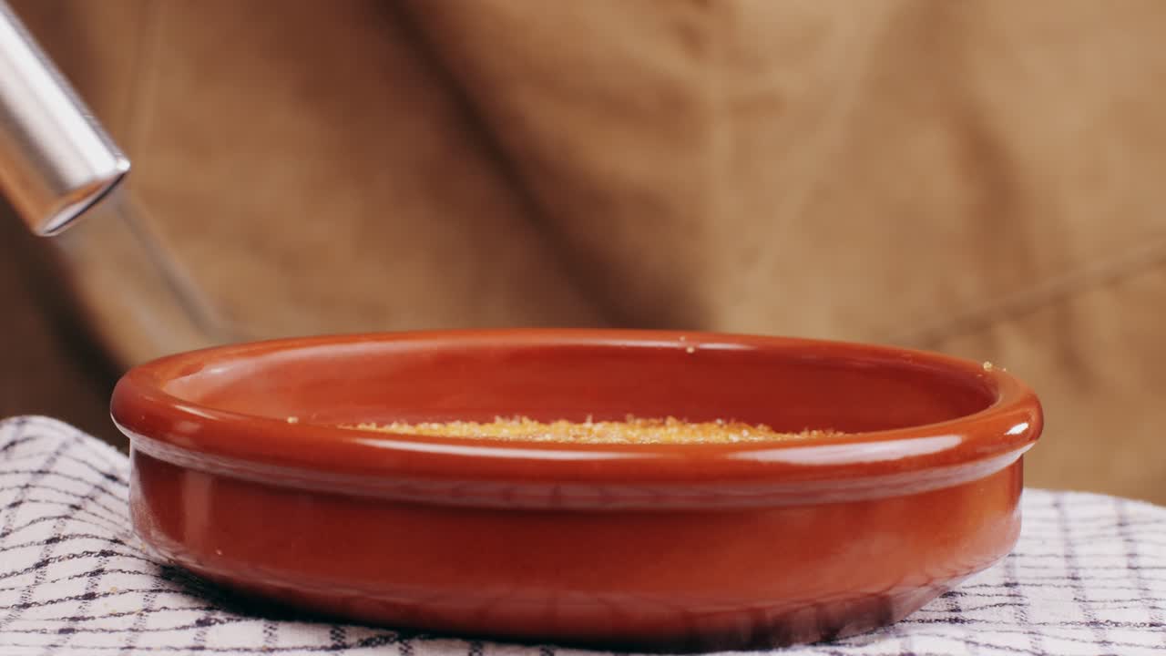 Spanish traditional food, catalonian dessert, crema catalana, catalan cream, spanish dessert close up, cooking.