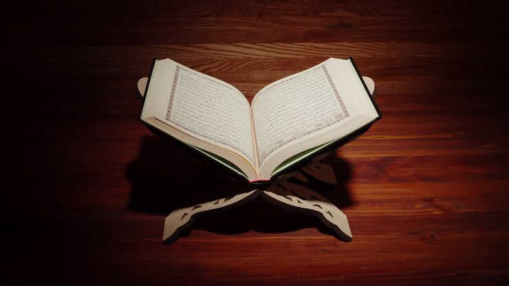 Quran book close-up, praying, islamic religion. Religious holiday Ramadan, holy month. Worship, making traditional prayer to God