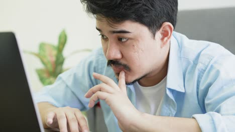 slow motion scene of middle east man working on laptop to thinking about strategy and planning on company's new project at office for lifestyle concept