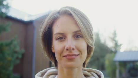 portrait of a smiling woman outdoors