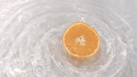 Orange-turning-in-water-in-super-slow-motion