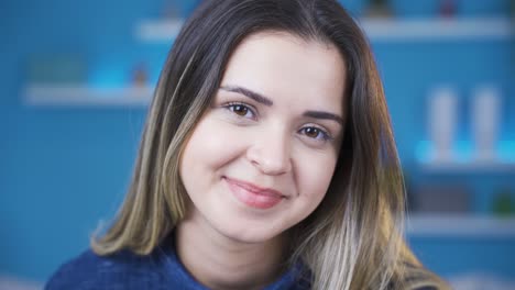 beautiful and attractive young woman smiling looking at camera.