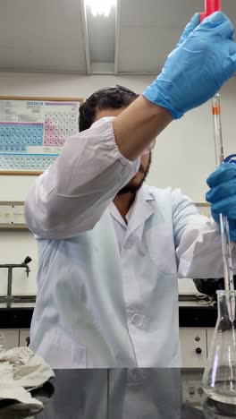 scientific procedure in progress with pipette