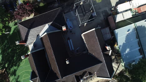 aerial orbit and spin looking directly down over church converted into school in melbourne inner suburbs