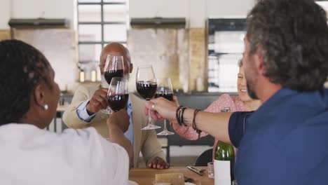 friends drinking wine and eating