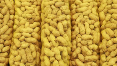 Peanuts-in-a-packet-lined-up-,