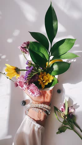 woman holding a beautiful flower arrangement