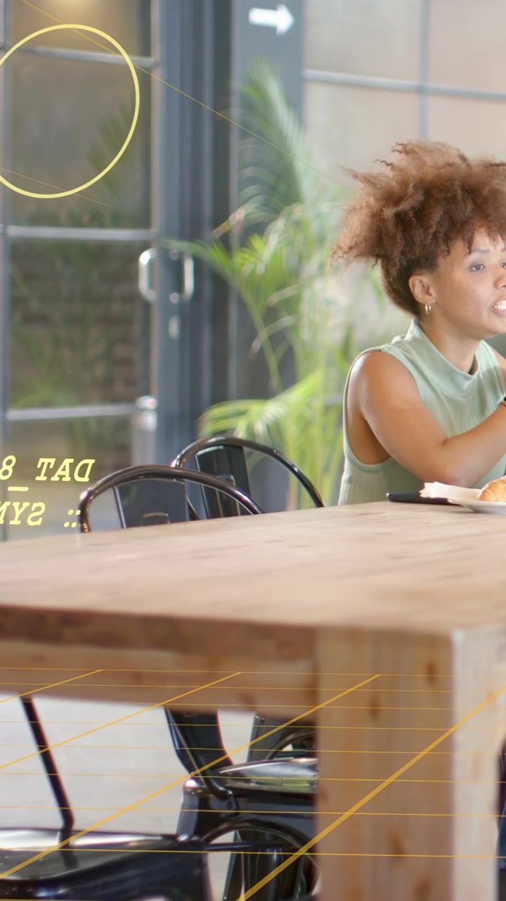 Vertical video: Woman opening mouth, gesturing at table, AR grid and DAT text during IT sync talk
