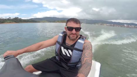 man-driving-jet-ski-on-lake