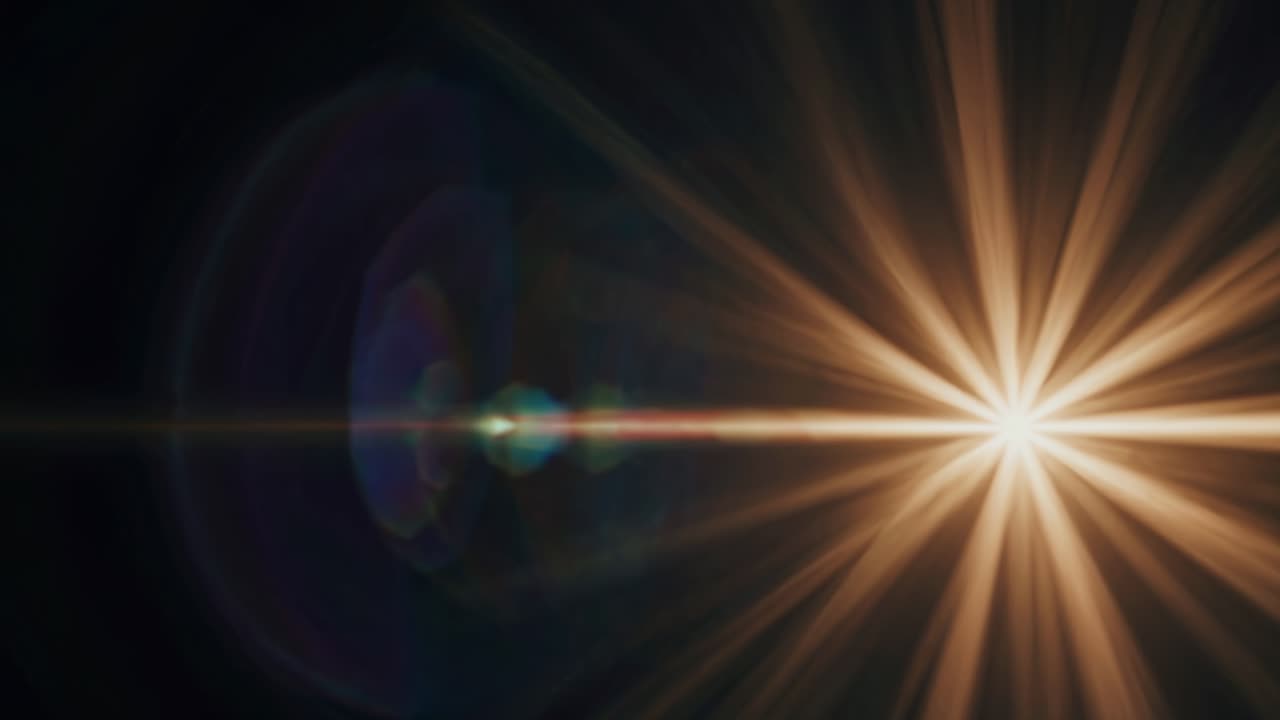 A dynamic, abstract video still of a bright light burst with lens flare, captured from a frontal