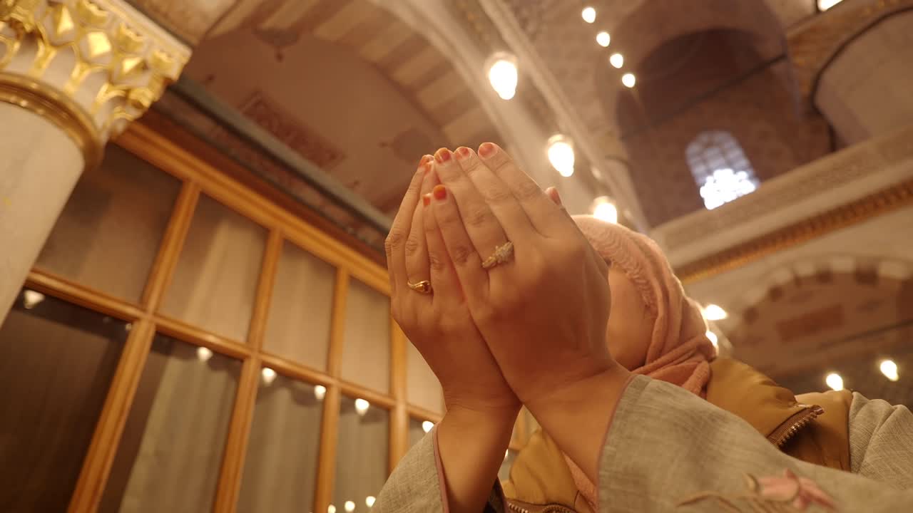 Woman praying in a mosque