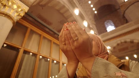 woman praying in a mosque