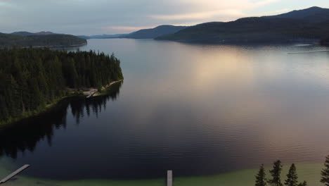 mountain lake under a cloudy sky in priest lake idaho usa - aerial drone shot