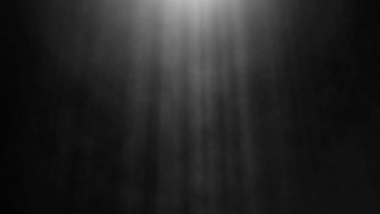 Smoke and Light Rays Flowing Across a Black Background with Billowing Fog and Glowing Rays for a Cinematic Atmosphere