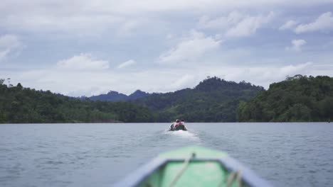 a boat travelling to the rural on the lake of batang ai going to nanga ukom longhouse